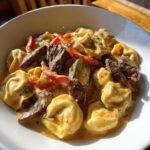 cheesesteak tortellini in creamy provolone sauce