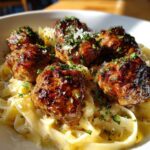 garlic butter meatballs served over creamy parmesan linguine